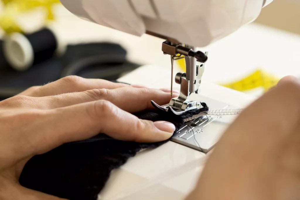 high-angle-of-sewing-machine-being-used-1024x683